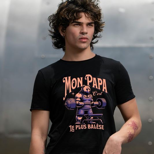 Tee-shirt noir imprimé "Mon papa c'est le plus balèse" avec un ours altèrophile